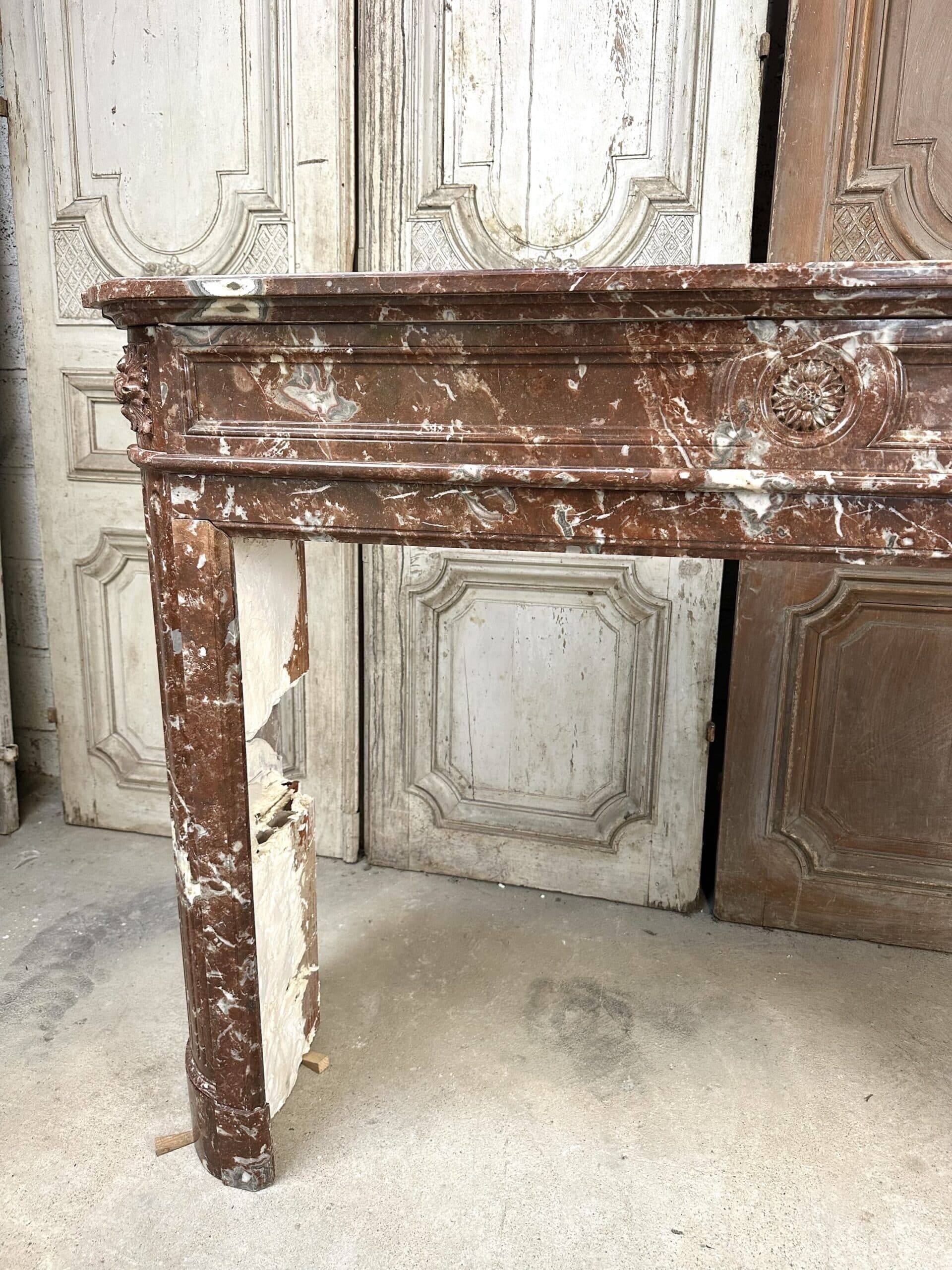Red marble fireplace in the Louis XVI style, late 19th century