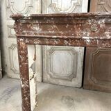 Red marble fireplace in the Louis XVI style, late 19th century