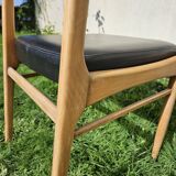Scandinavian chair with faux leather seat and back