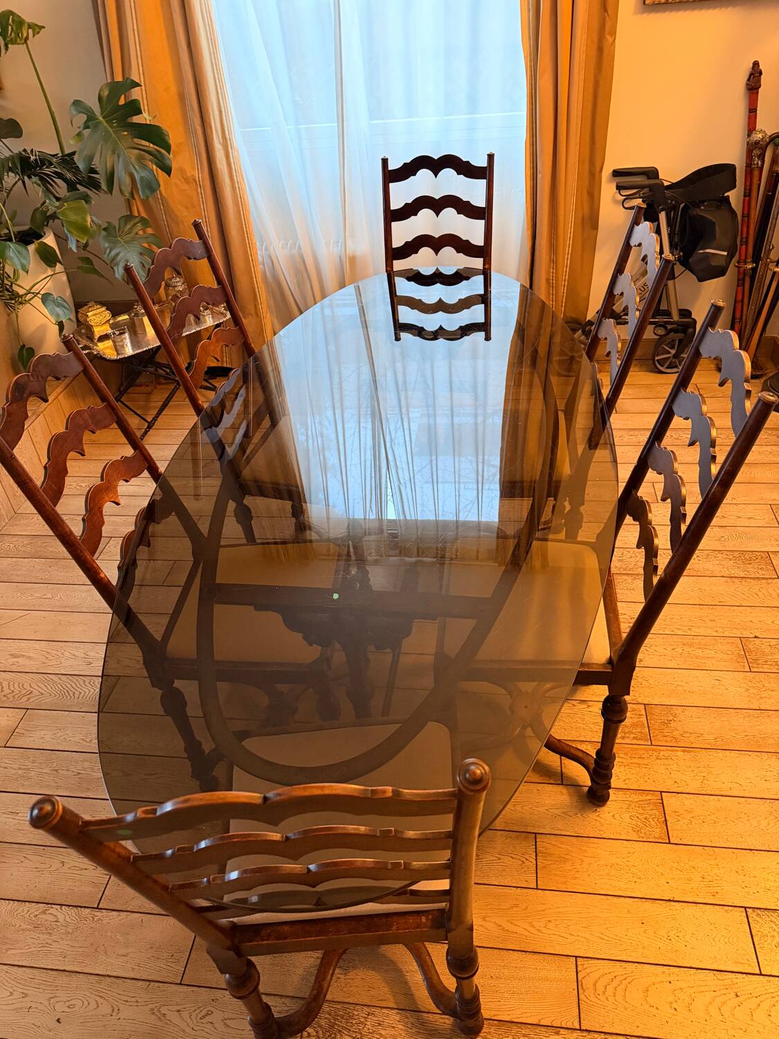 Large antique dining table in wrought iron and smoked glass,