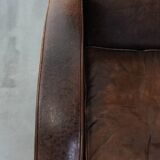 Set of two vintage sheepskin leather design armchairs in a cognac colour