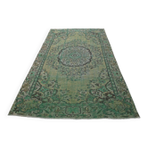 Vintage green and olive Turkish rug with a medallion, hand-knotted, 160 x 262 cm.