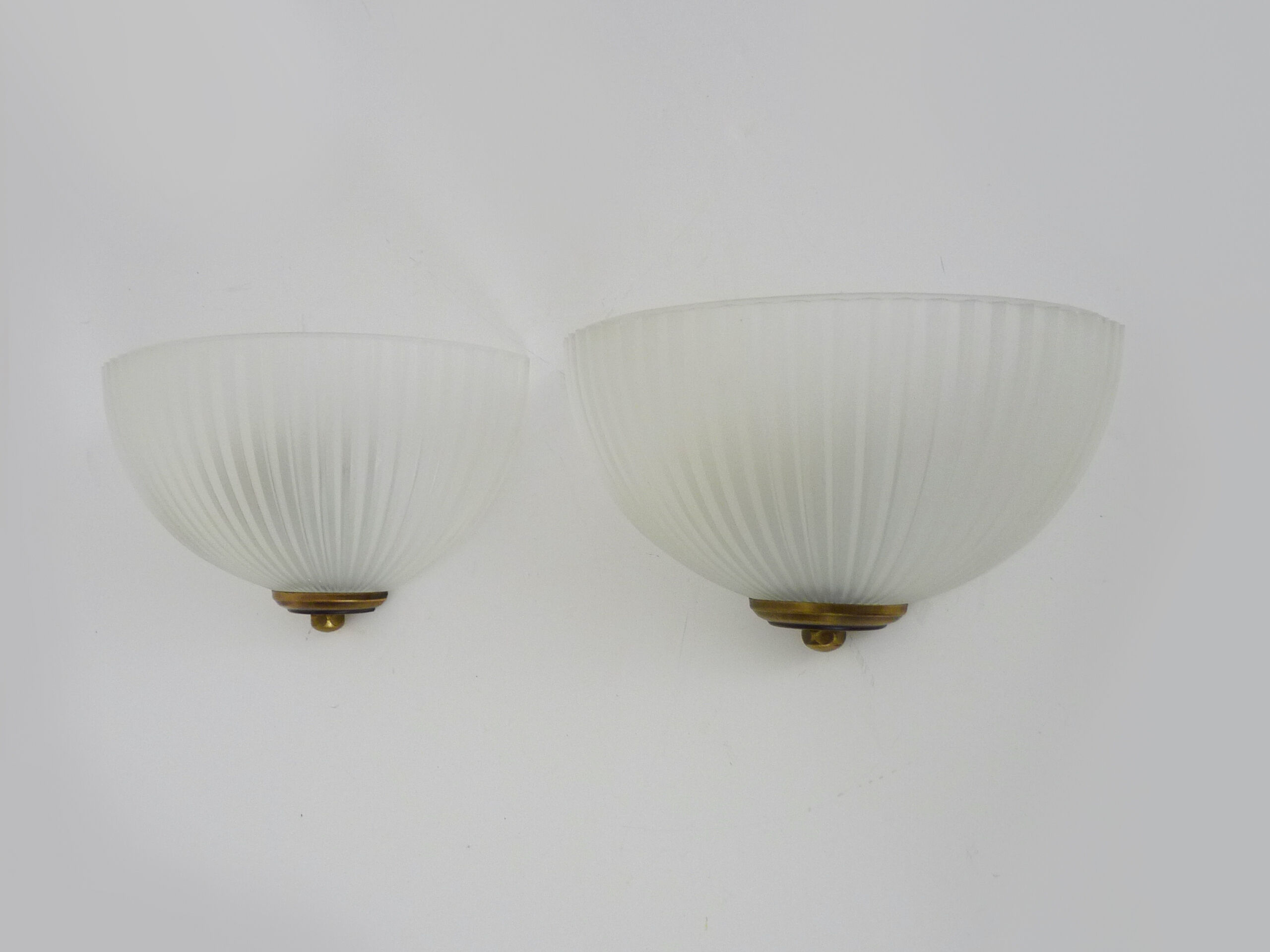 Pair of Mathias wall lamps in gilded metal and white shell-style glass