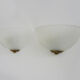 Pair of Mathias wall lamps in gilded metal and white shell-style glass