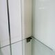 White vintage slatted display case on gold legs