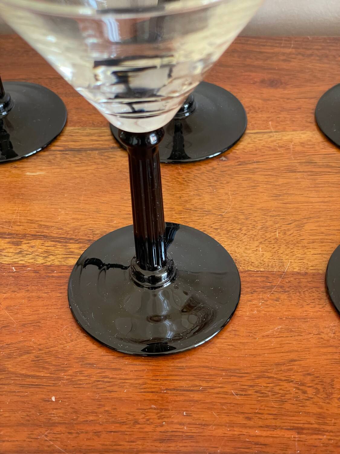 6 black stemmed glasses