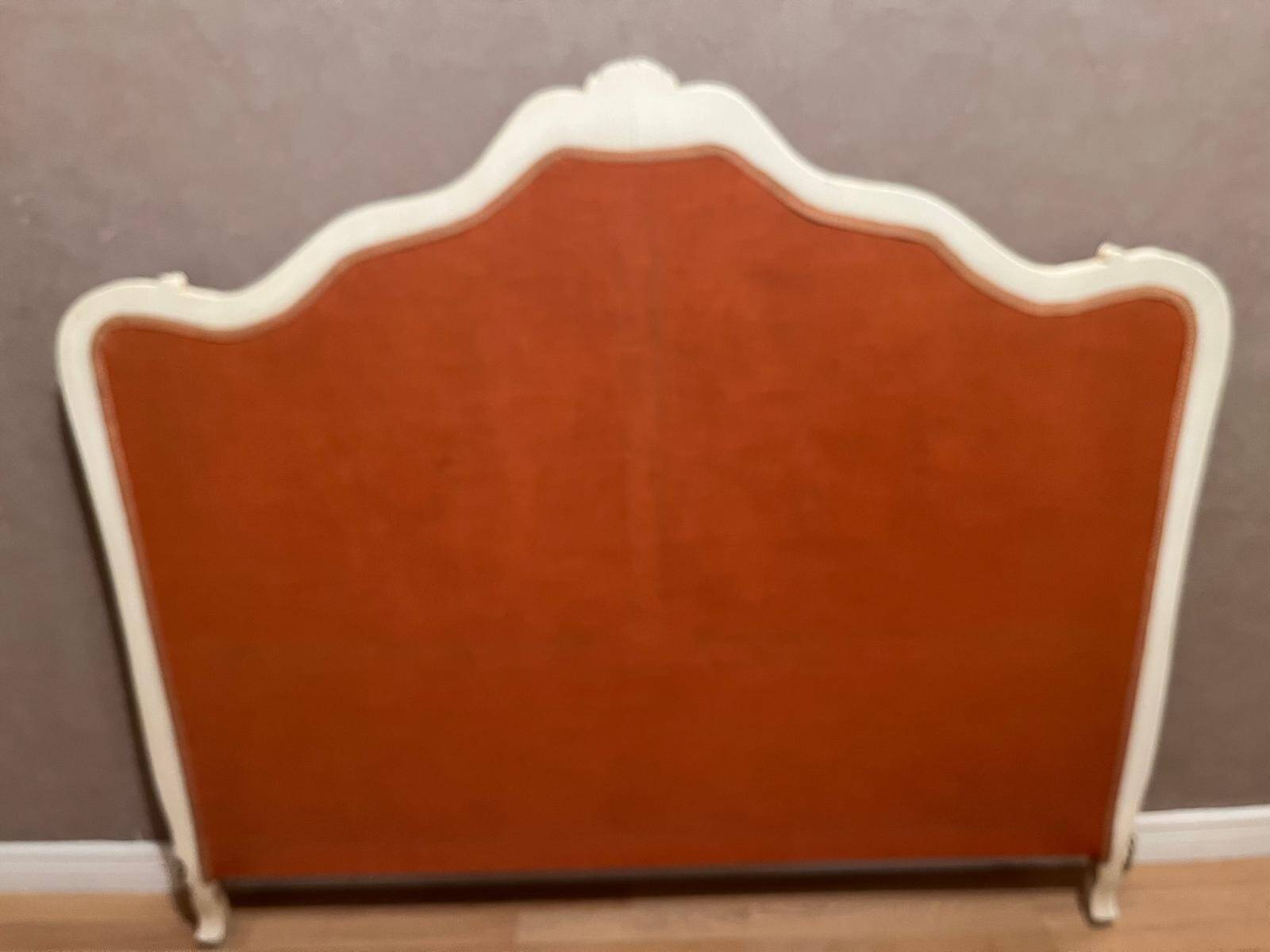 Upholstered bed in rosewood fabric