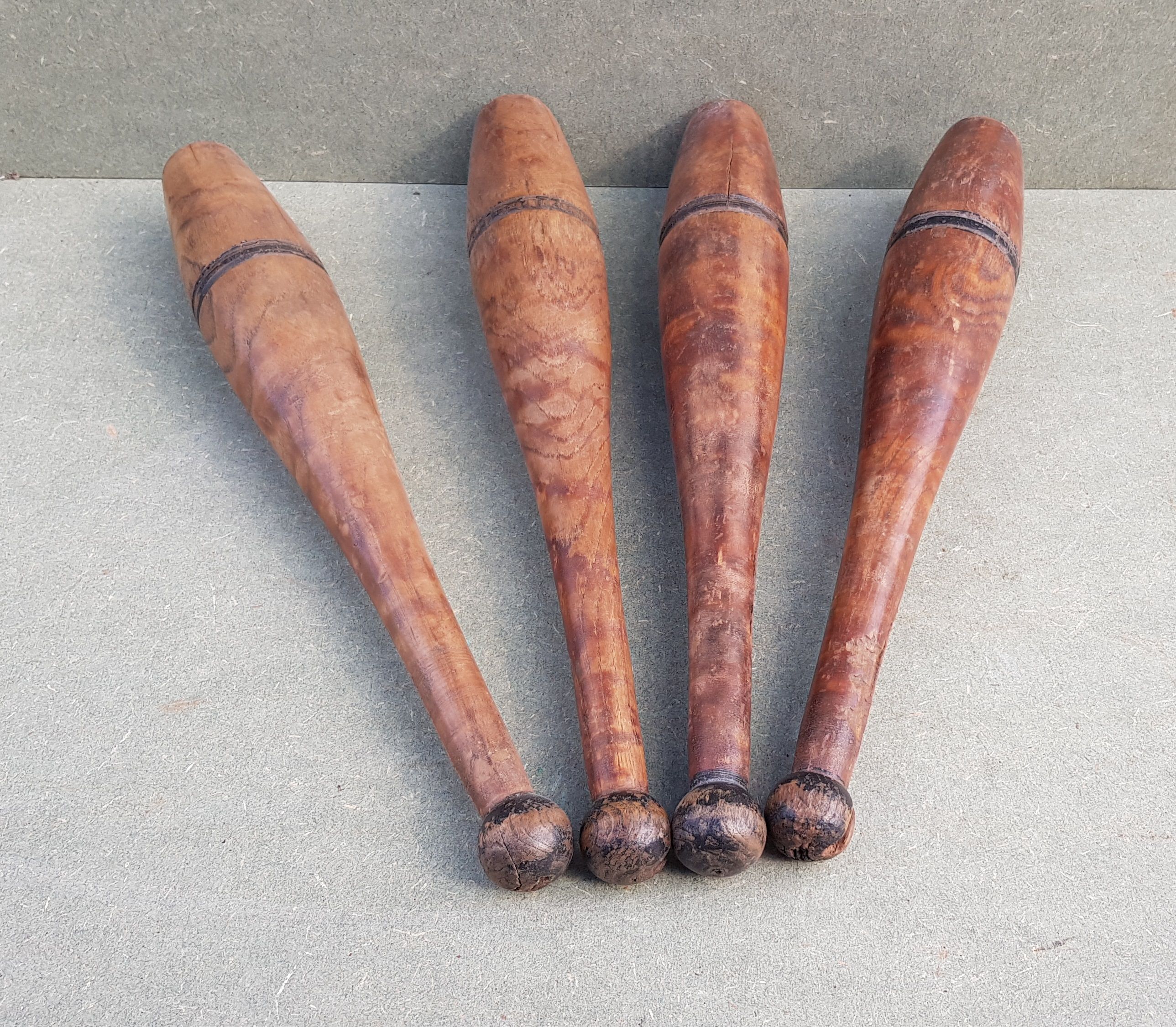 Set of 4 old English juggling clubs circa late 19th