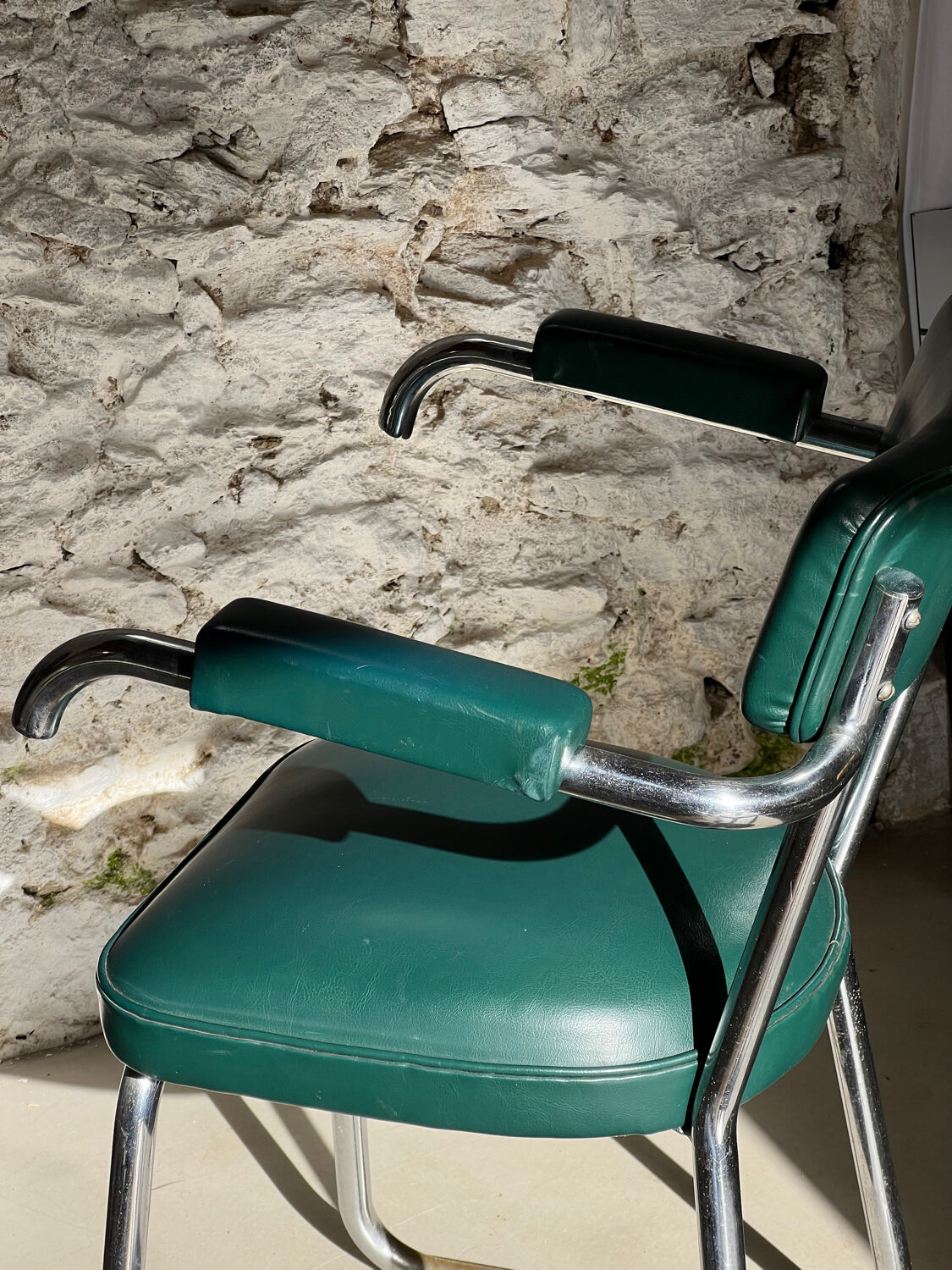 Pair of green vinyl and chrome armchairs, mid-century