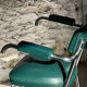 Pair of green vinyl and chrome armchairs, mid-century