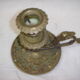 Ancient candlestick in carved bronze ram