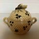 Old honey pot with bee decoration