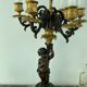 Candelabra with cherub in patinated bronze