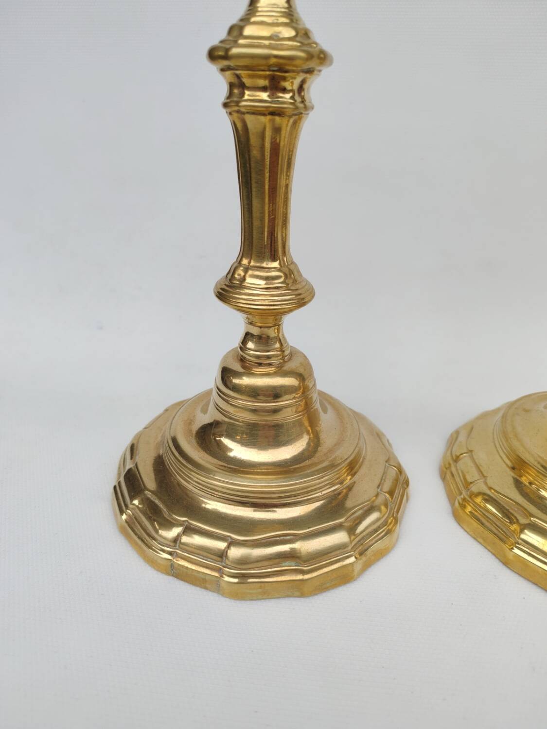 Pair of solid brass candlesticks, early 18th century.