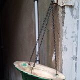 Hanging planter in green earthenware