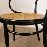Curved wood and cane armchair called "Le Corbusier"