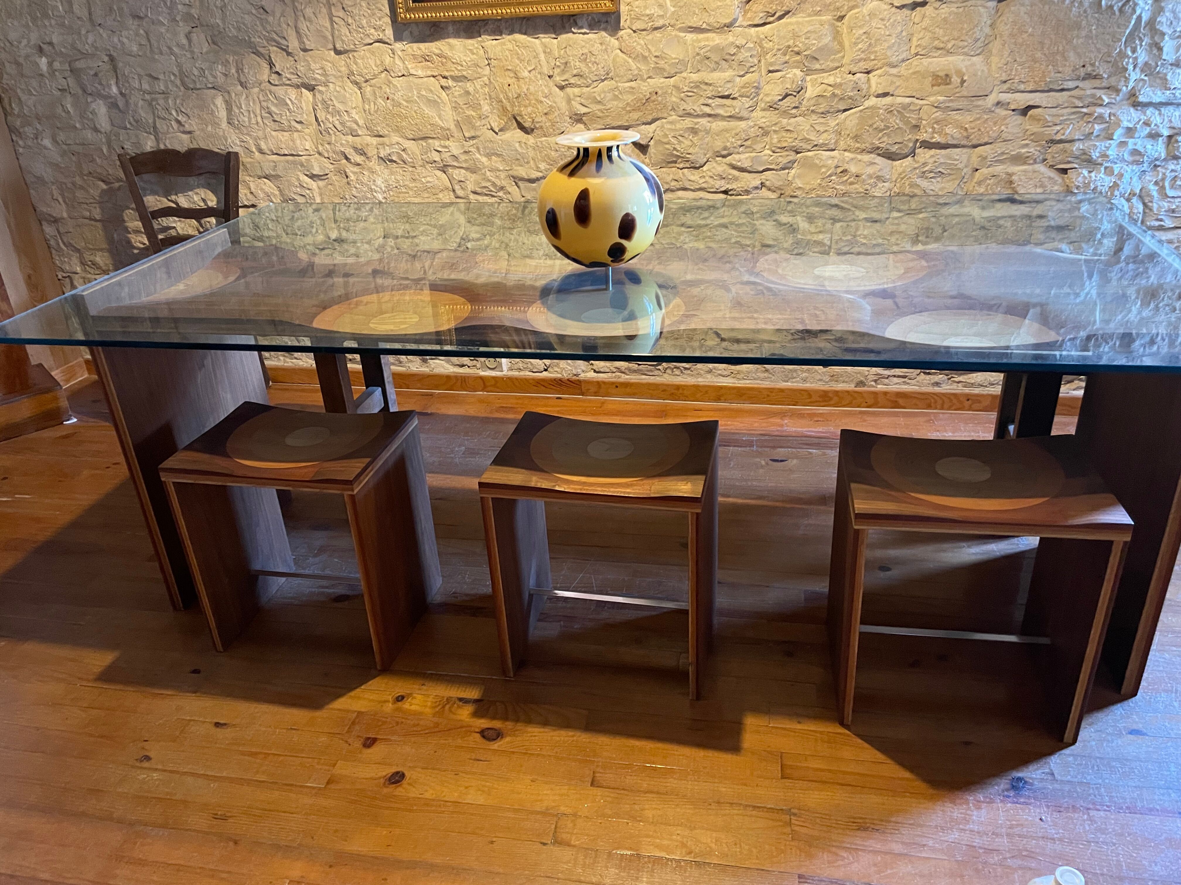 Dining table and 3 Ripples stools by Toyo Ito.