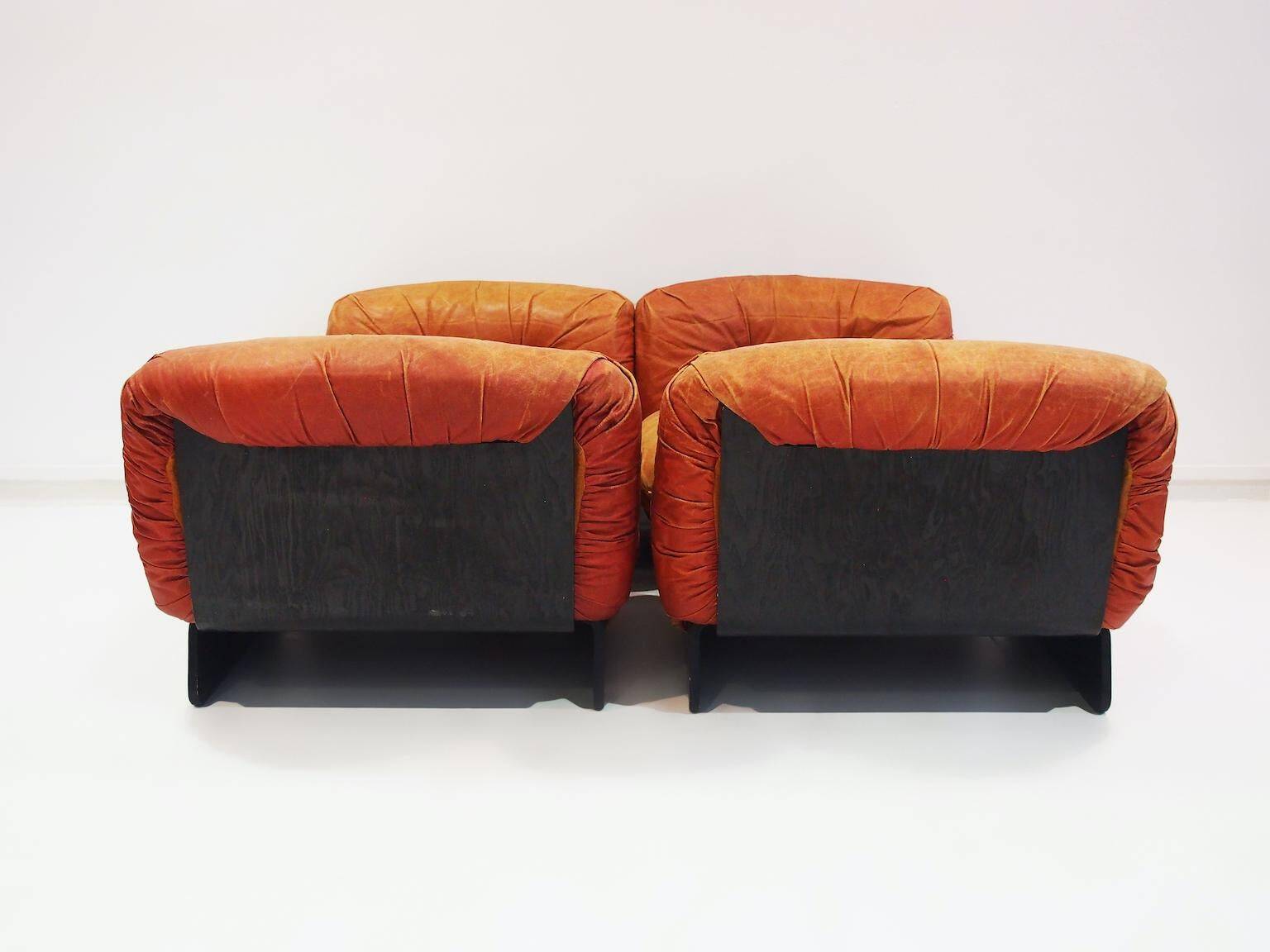Set of four modular sun loungers by Giuseppe Munari upholstered in cognac leather.