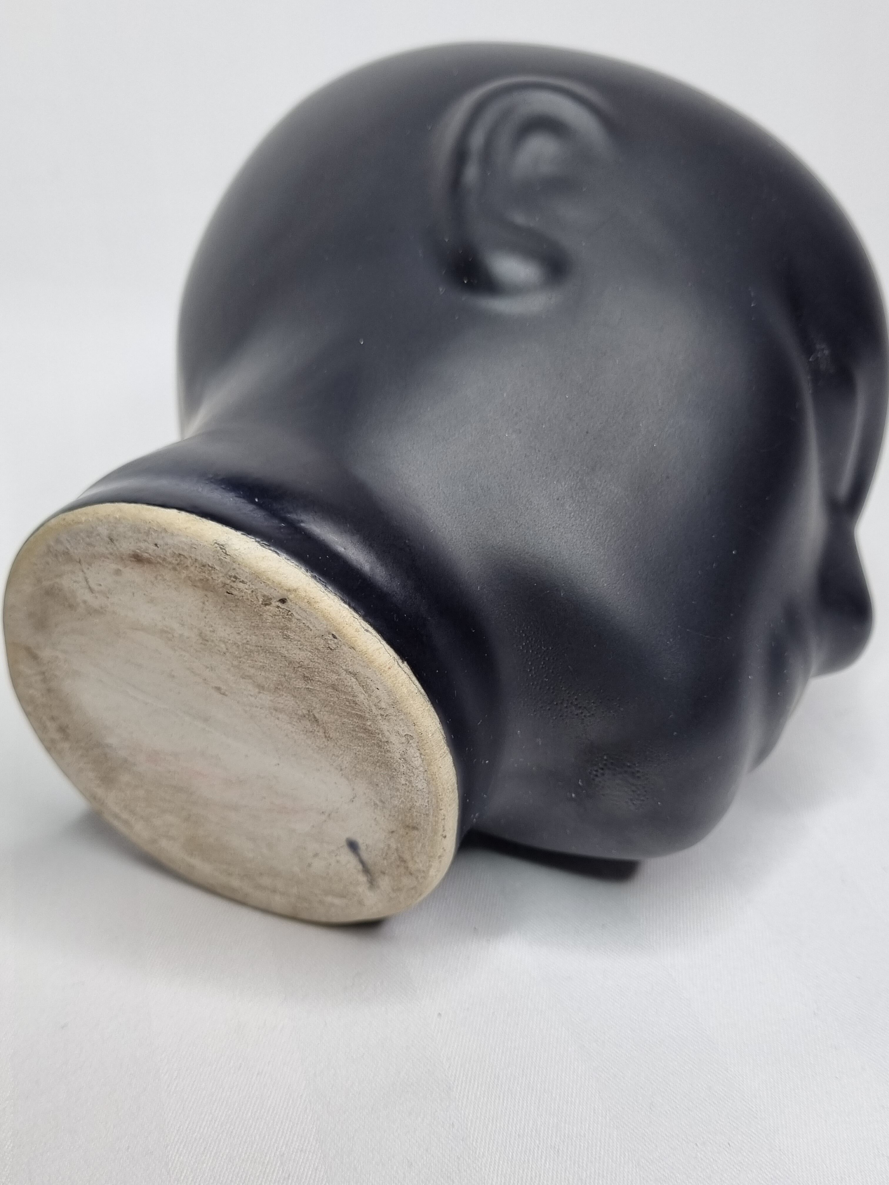 Anthropomorphic pot cover in matt black glazed ceramic, 80s