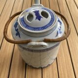 Asian teapot in basket
