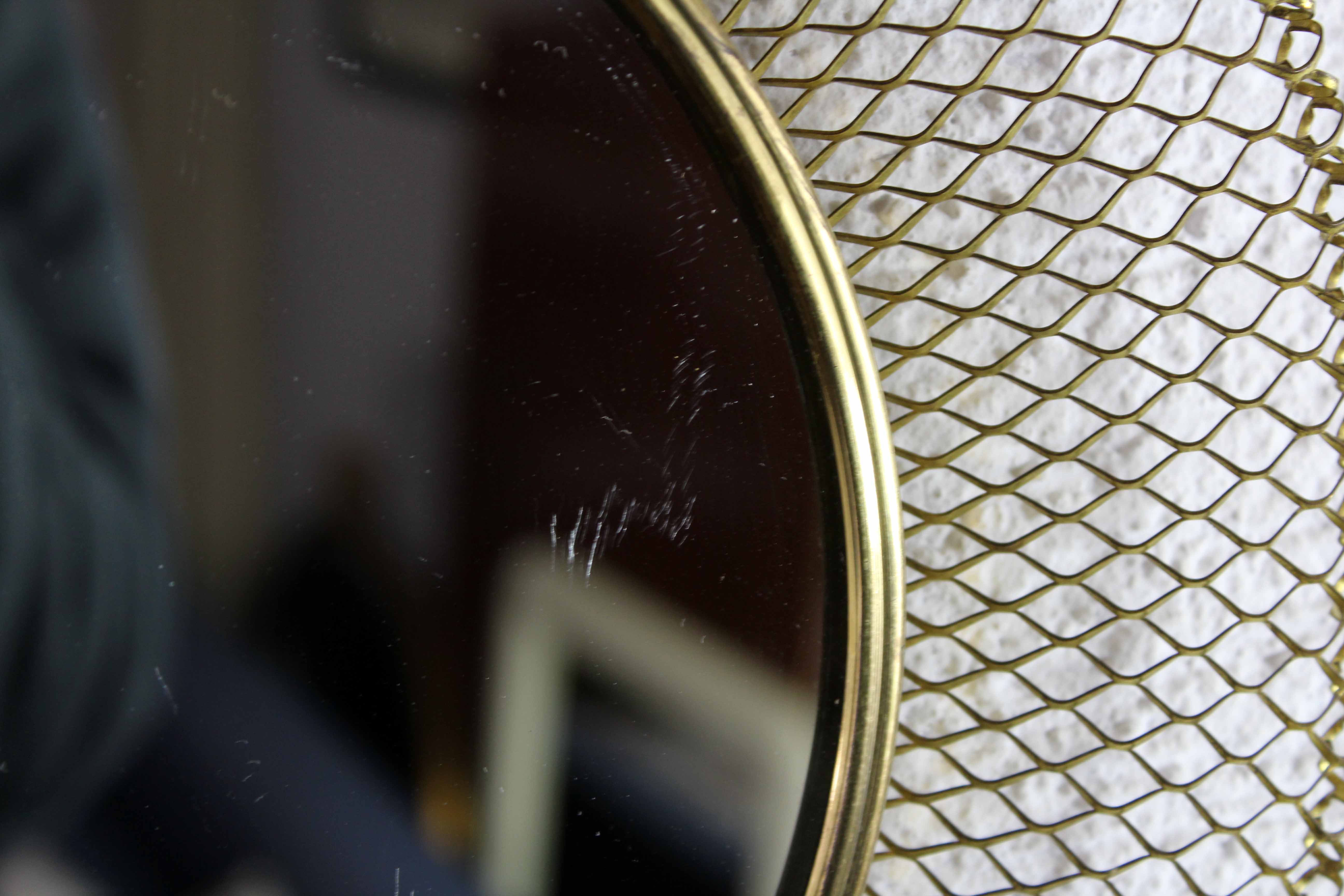 Vintage round mirror in gilded metal