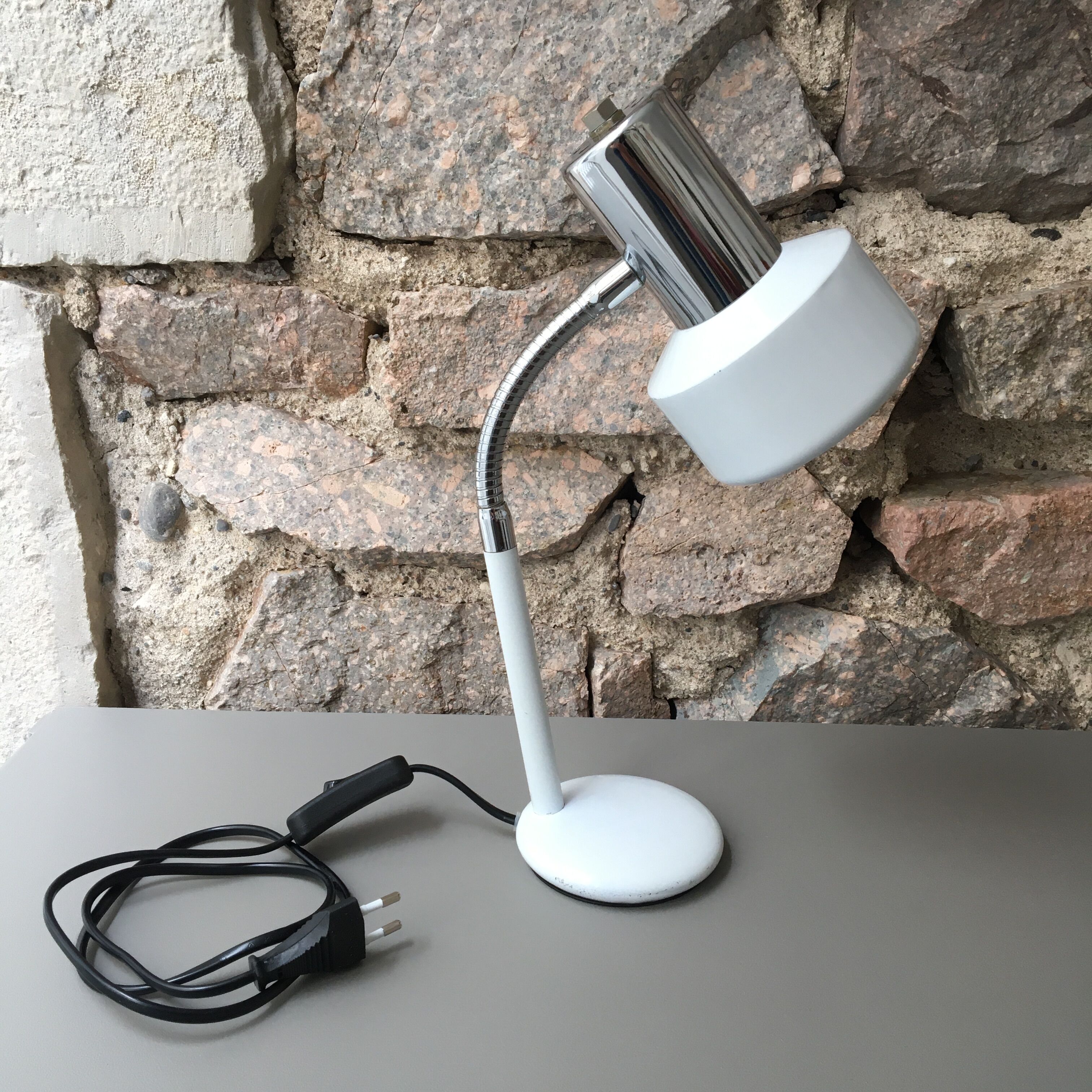 flexible white and stainless steel desk lamp