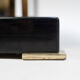 Coffee table in black hairspray, glass and gilded brass, 1970s