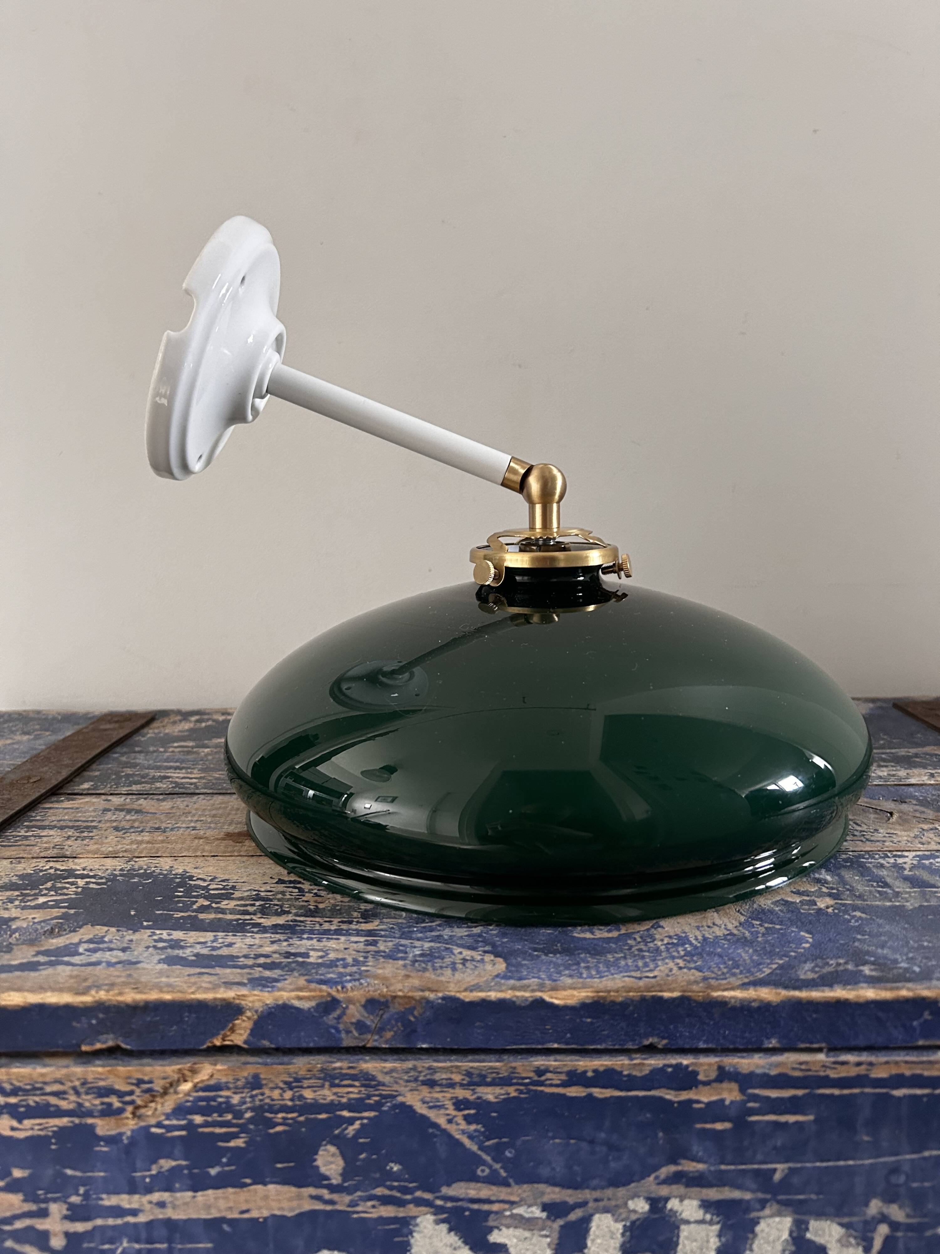 Tilting wall light in green opaline