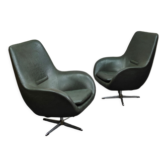 Pair of swivel armchairs space age dark green imitation leather