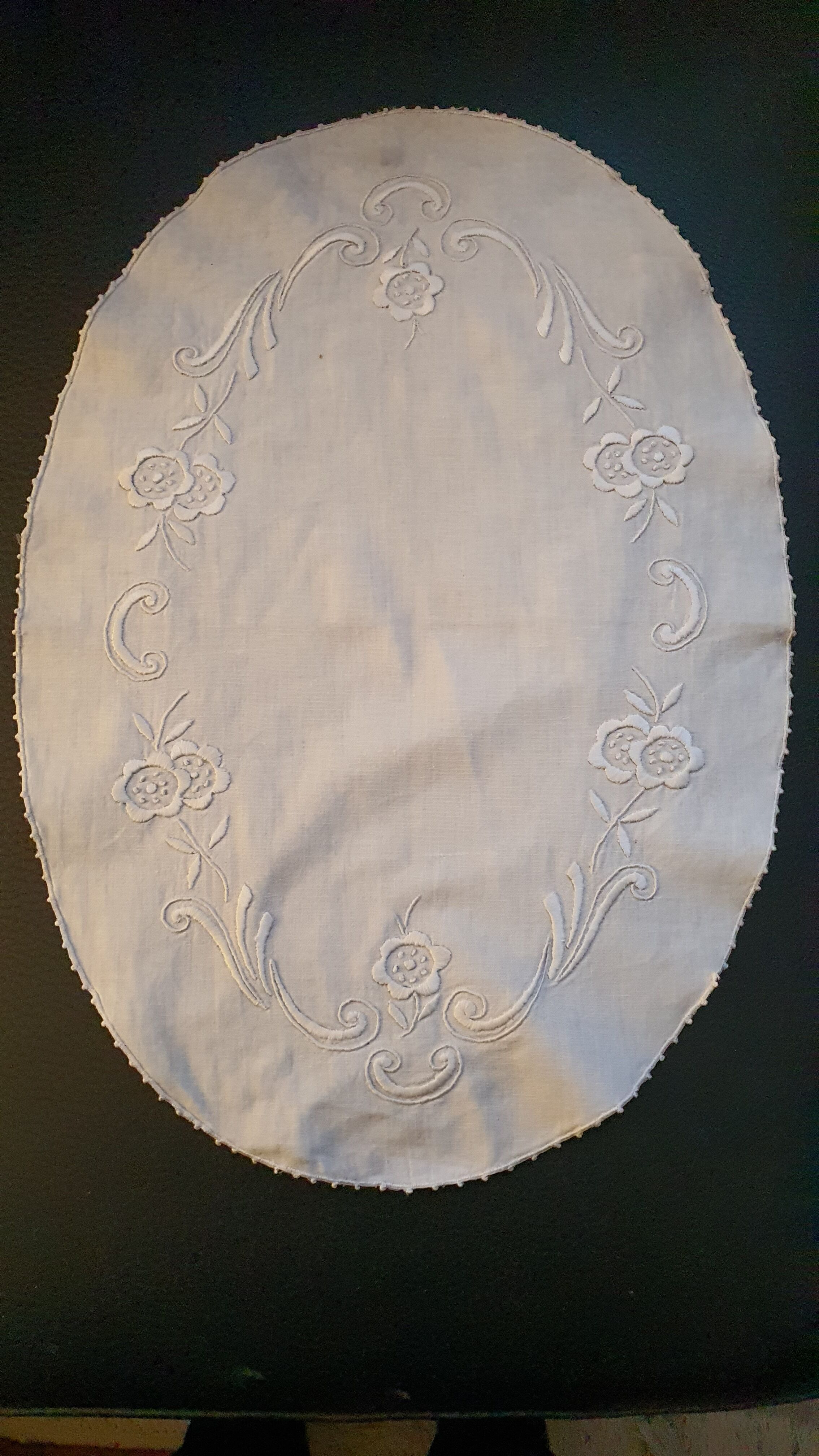 Hand-embroidered oval placemat