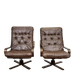 Pair of Norwegian swivel armchairs in leather and beech from the 1970s.