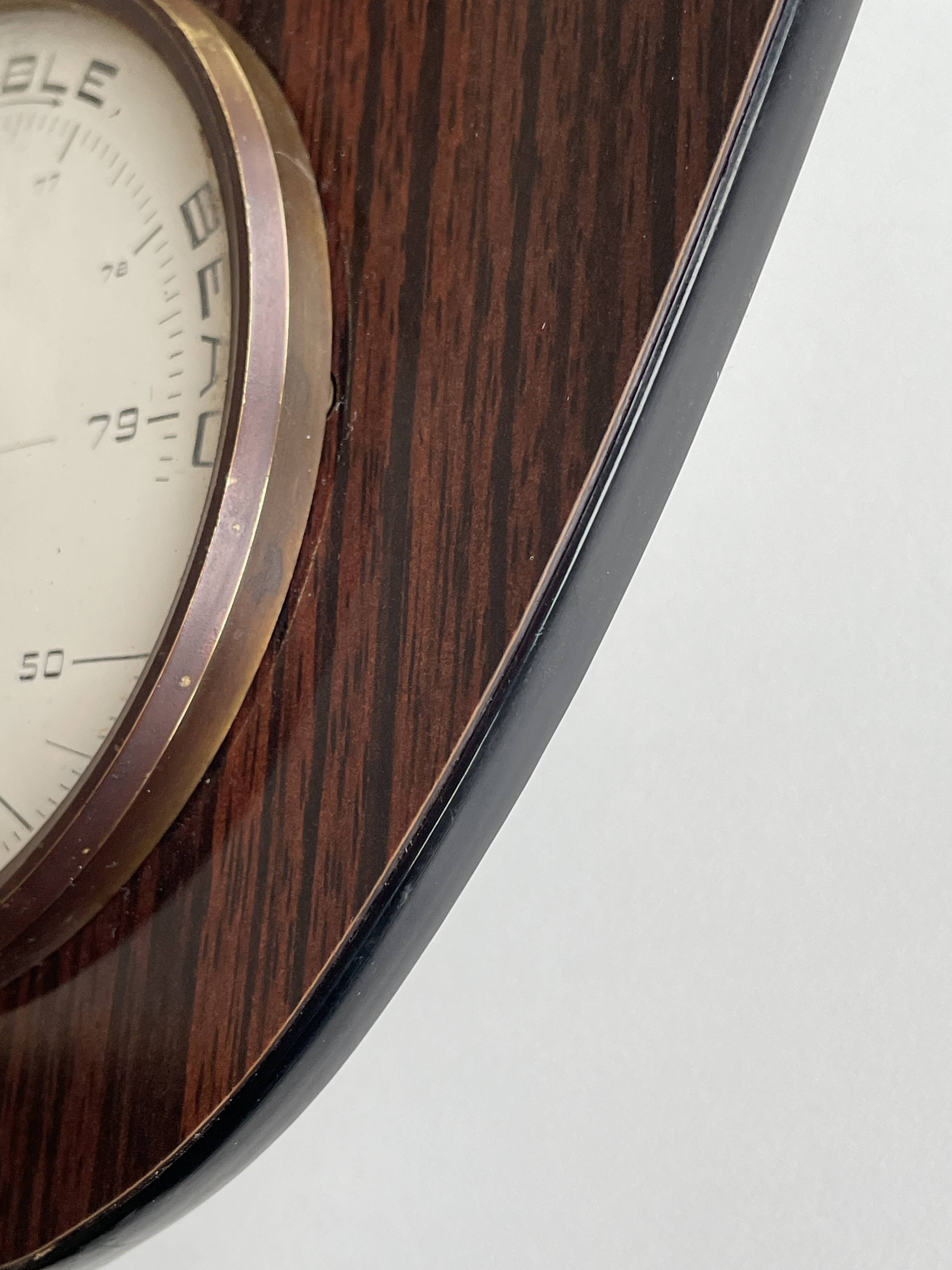 Vintage 1960s wall clock with thermometer and date