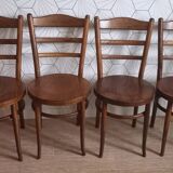 Set of 4 Baumann bistro chairs with round seats.
