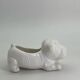Ceramic flower pot in the shape of a dog