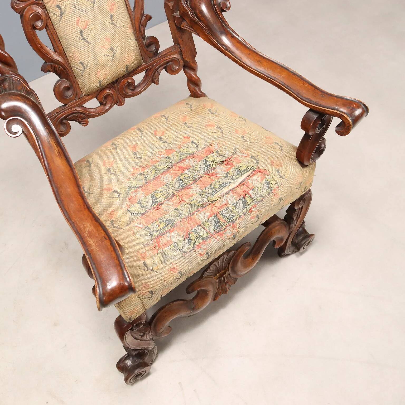 Pair of antique Baroque armchairs in walnut and fabric, Italy, 17th century.