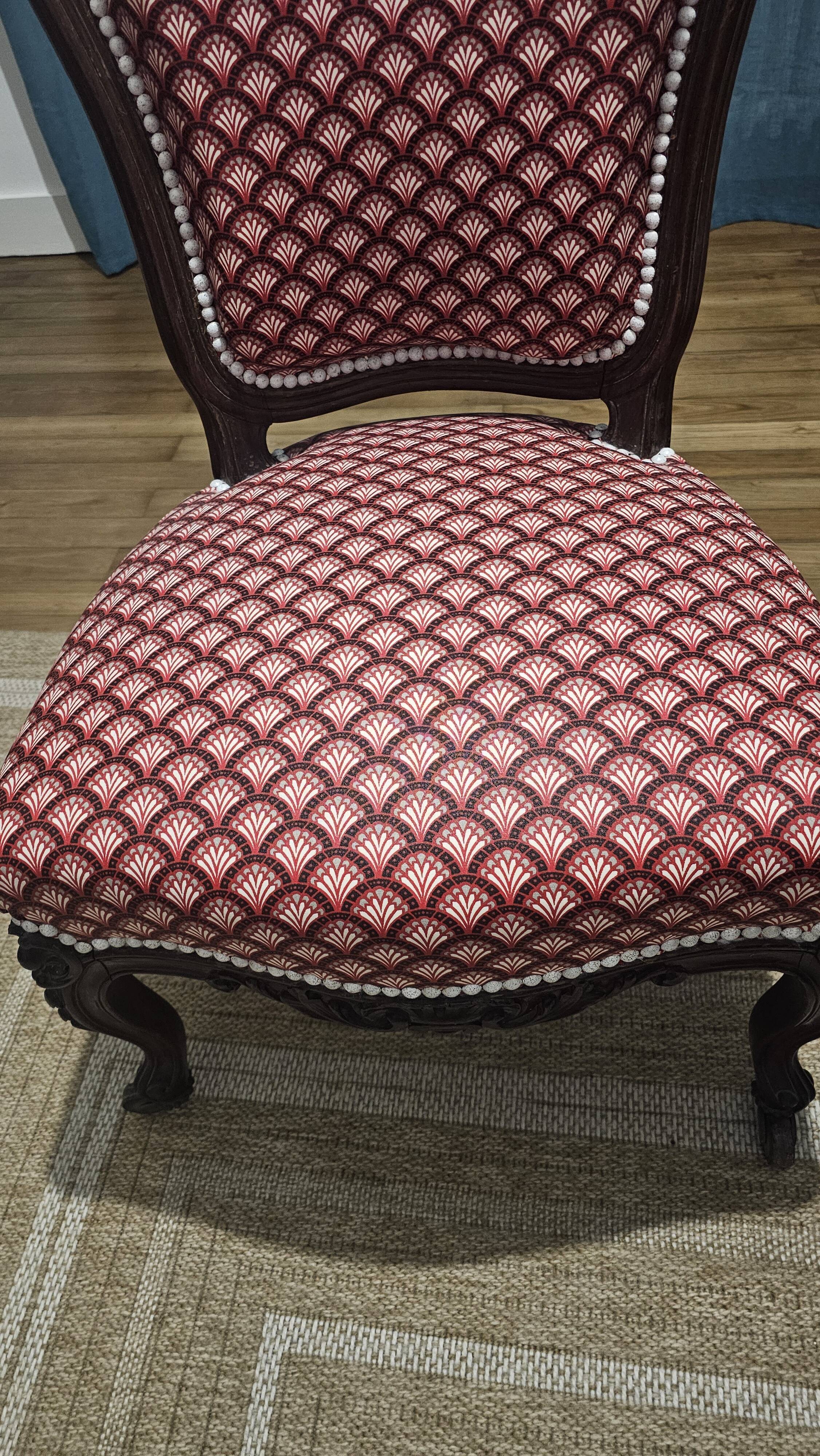 Napoleon III armchair reinterpreted – carved wood and shell pattern fabric