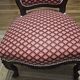 Napoleon III armchair reinterpreted – carved wood and shell pattern fabric