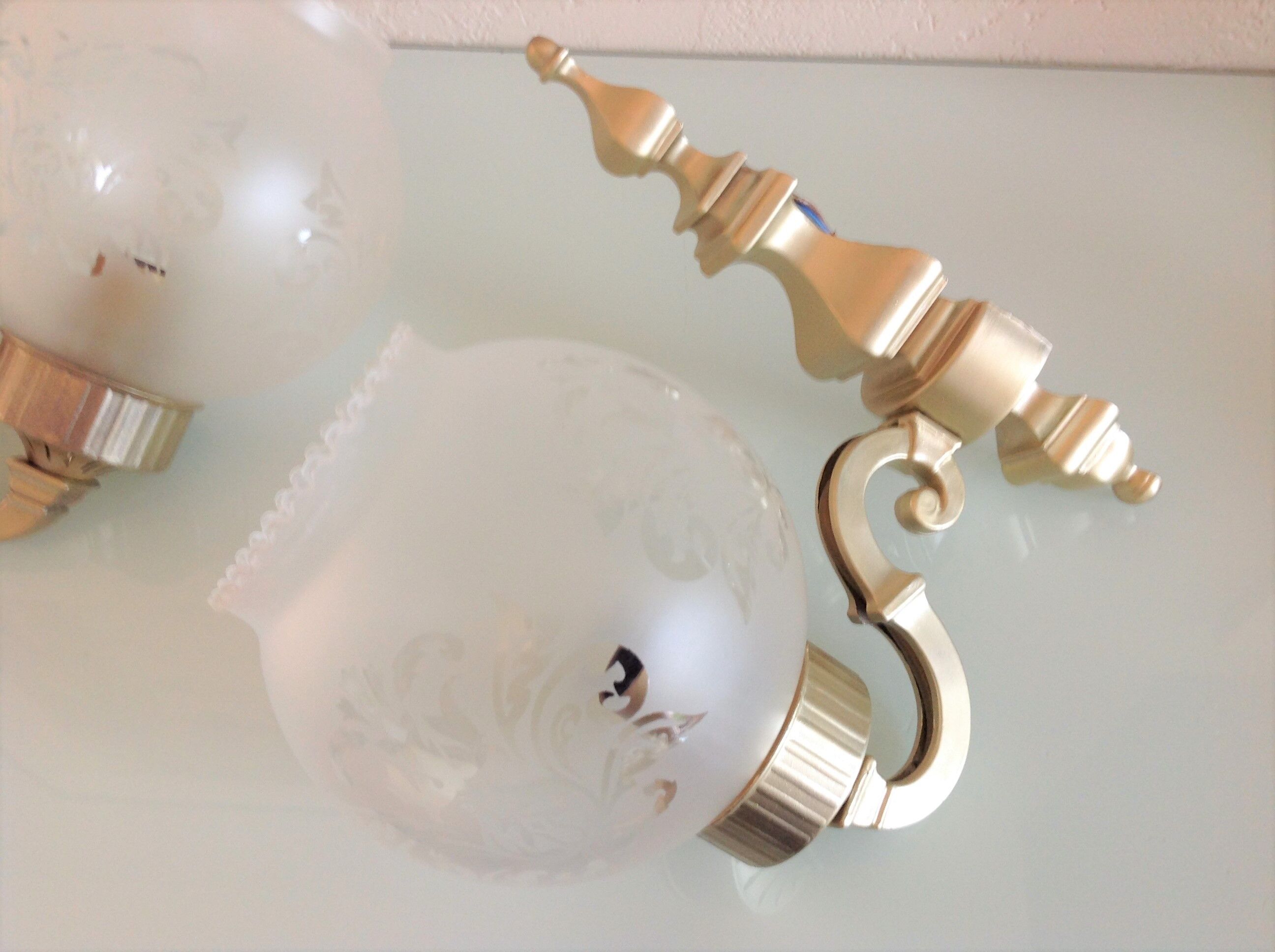 Pair of wall lamps in gilded metal and frosted glass art deco style
