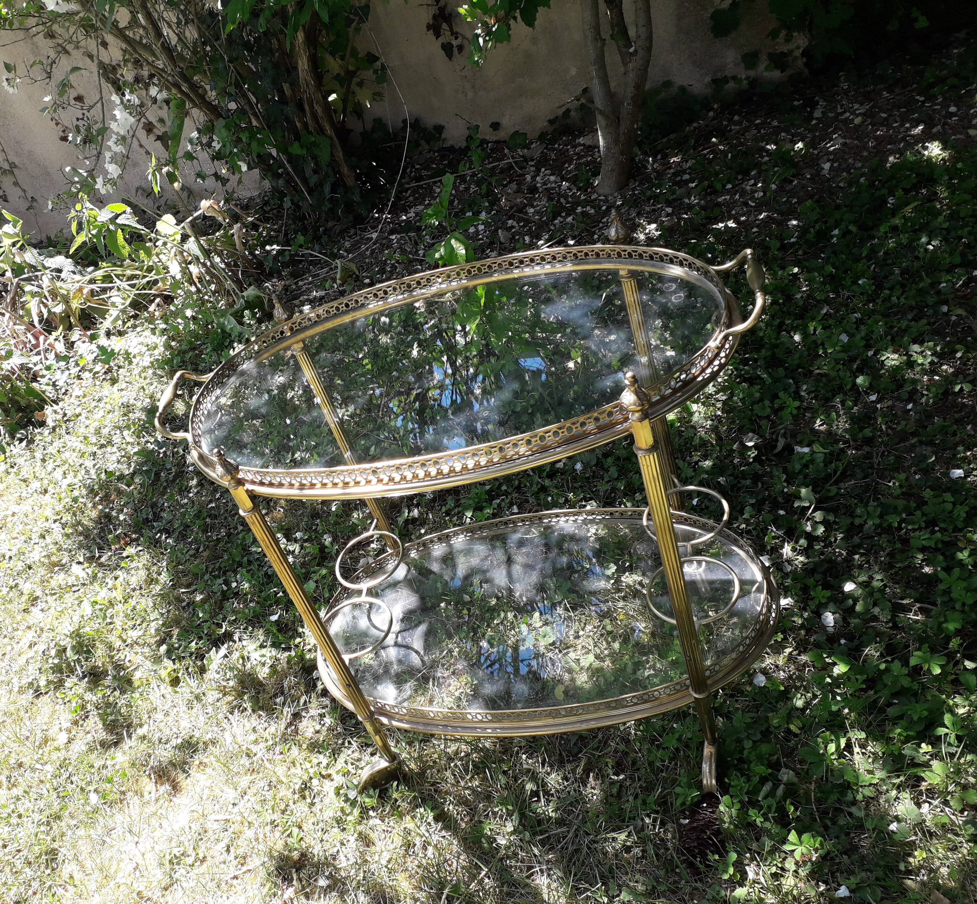 Dessert on brass wheels and glass door bottles year 60