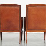 Majestic, luxurious set of 4 cognac-colored cowhide leather Art Deco design armchairs