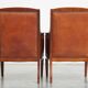 Majestic, luxurious set of 4 cognac-colored cowhide leather Art Deco design armchairs