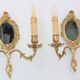 Pair of Louis XV style beveled mirror sconces in bronze by Lucien Gau