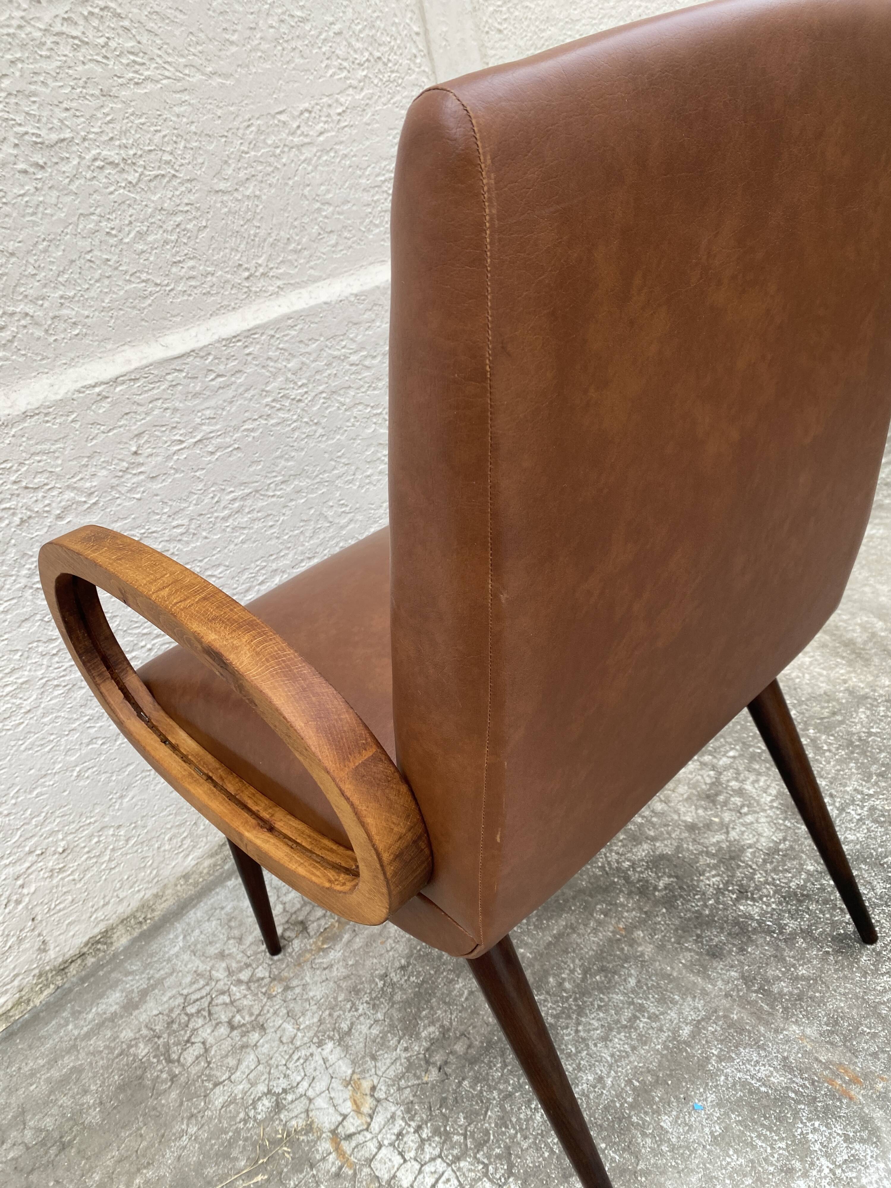 Mid-Century Scandinavian vintage retro armchair with oval armrests.