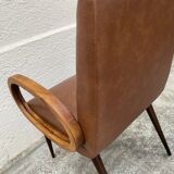 Mid-Century Scandinavian vintage retro armchair with oval armrests.