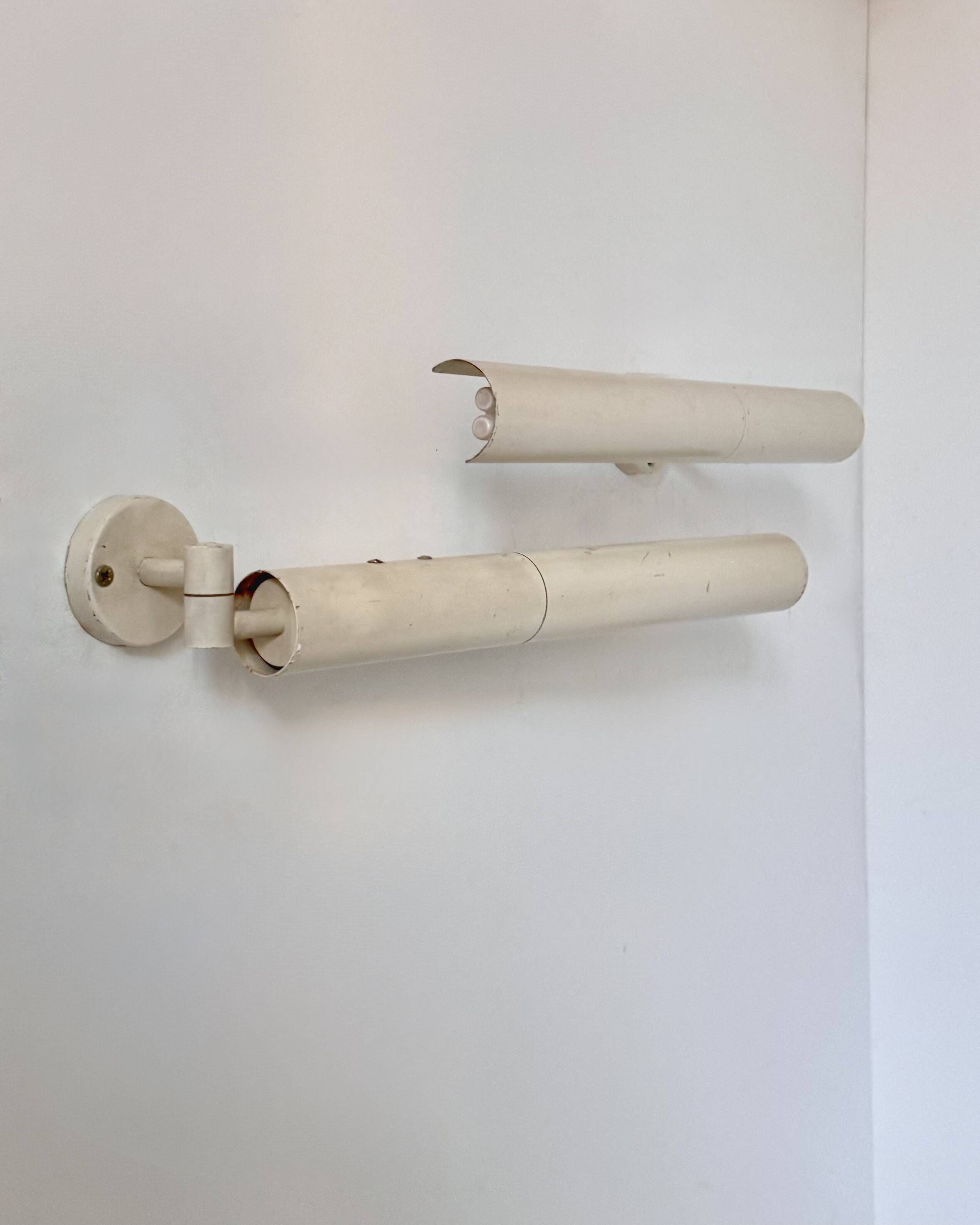 Pair of vintage matte white metal wall lights, France 1970.