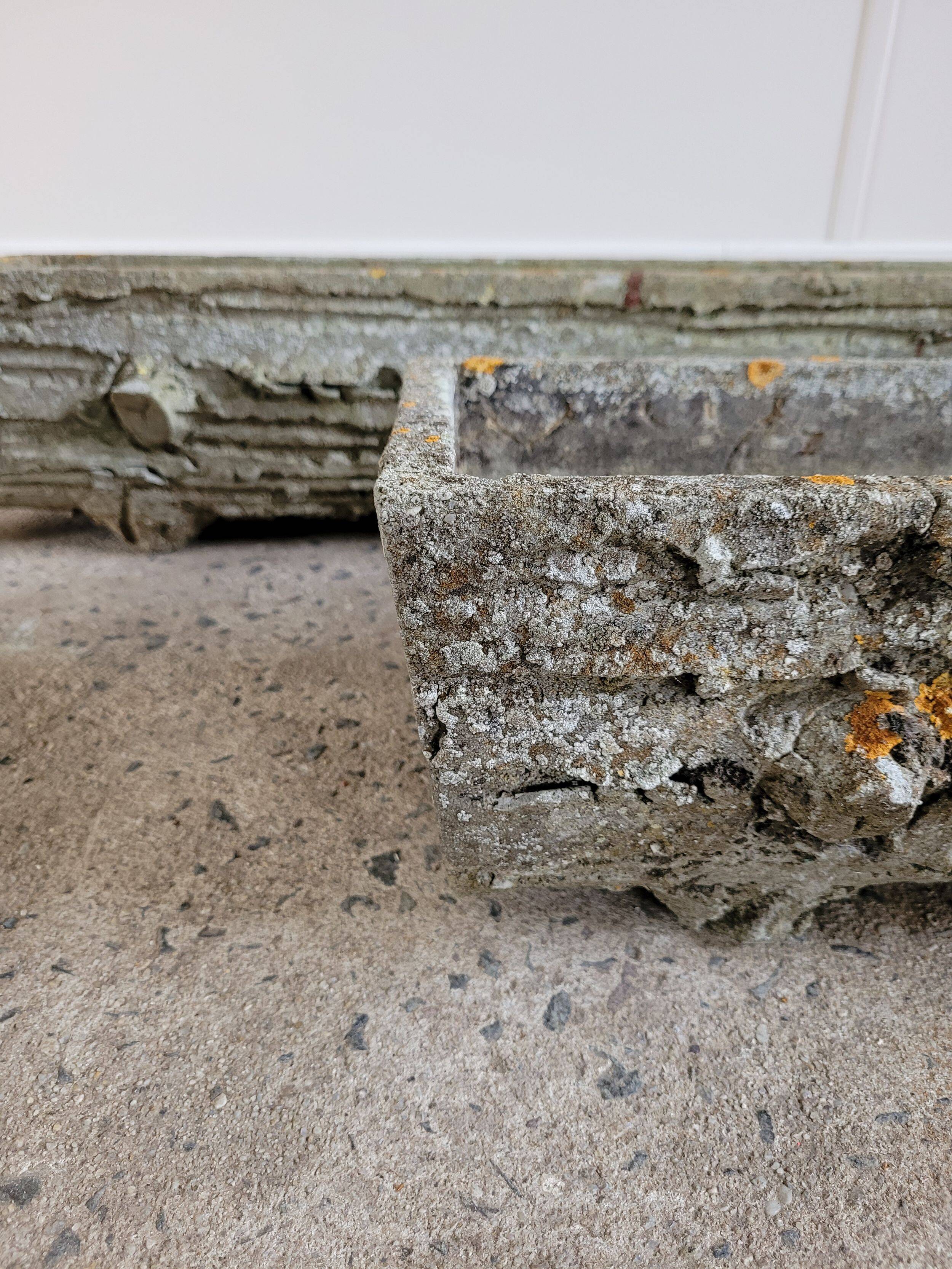 Old planters in faux cement wood