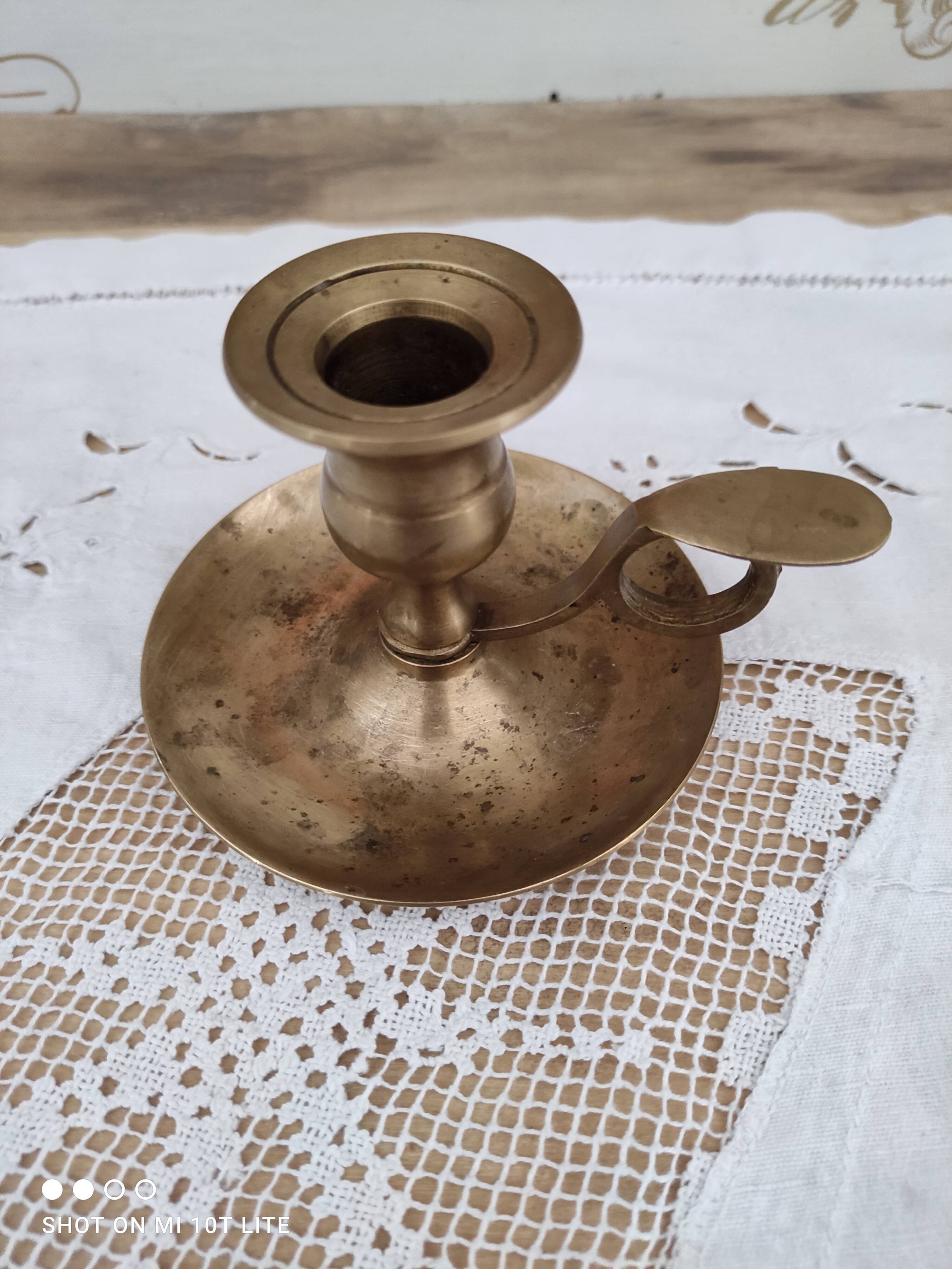 Hand candle holder called cellar rat in solid brass