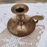 Hand candle holder called cellar rat in solid brass
