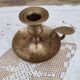 Hand candle holder called cellar rat in solid brass
