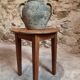 Antique round side table with oak legs and a pine top, circa 1900.